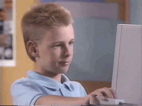 Thumbs up kid at the computer GIF meme